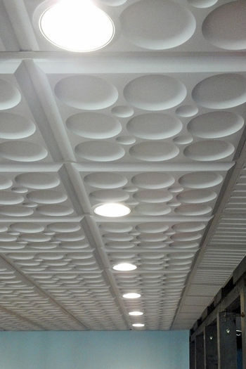 White Roman Circle Ceiling Tile in a Grid